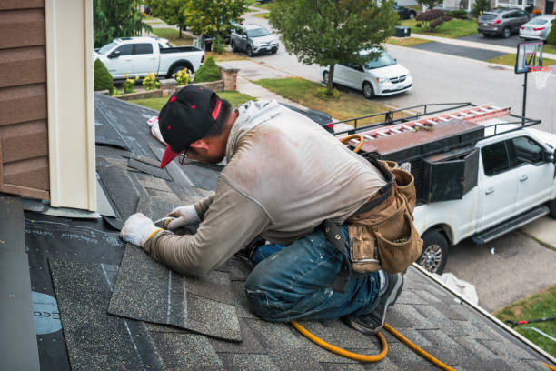 Professional Gutter Repair And Installation technician working in Amityville, NY